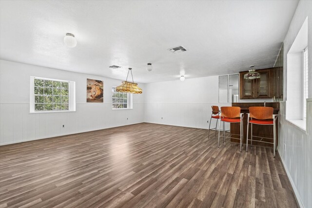 9203 Mauna Loa Ln, Houston, TX 77040 - interior space with visible vents, a wainscoted wall, and wood finished floors