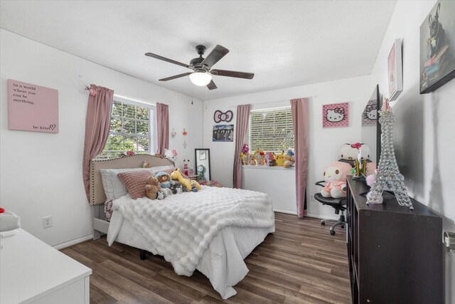 9203 Mauna Loa Ln, Houston, TX 77040 - bedroom with dark wood-type flooring, baseboards, and ceiling fan