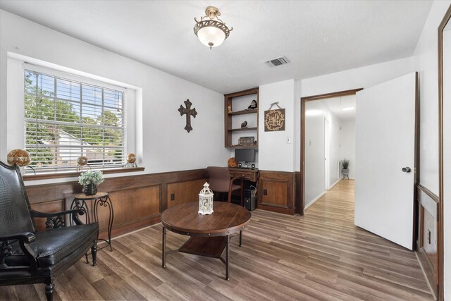 9203 Mauna Loa Ln, Houston, TX 77040 - sitting room with wood finished floors and visible vents