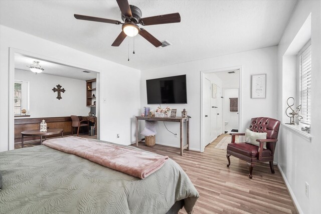 9203 Mauna Loa Ln, Houston, TX 77040 - bedroom featuring visible vents, baseboards, a ceiling fan, and wood finished floors