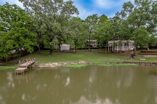 101 Tony Ln, Huntsville, TX 77320 - dock area with fence, a water view, and a lawn