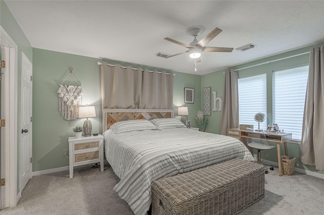 101 Tony Ln, Huntsville, TX 77320 - bedroom featuring visible vents, ceiling fan, light carpet, and baseboards