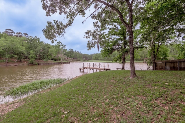 101 Tony Ln, Huntsville, TX 77320 - view of dock featuring a lawn, a water view, and fence
