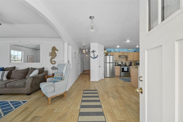 1014 Blue Water Hwy, Surfside Beach, TX 77541 - living area with light wood finished floors and arched walkways