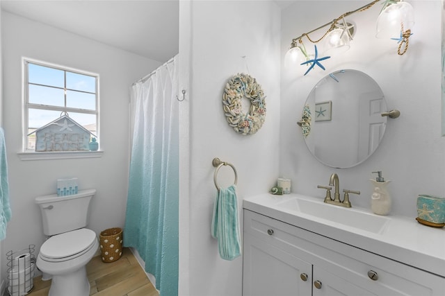 1014 Blue Water Hwy, Surfside Beach, TX 77541 - full bathroom featuring toilet, vanity, and wood finished floors