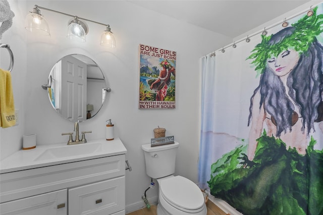 1014 Blue Water Hwy, Surfside Beach, TX 77541 - bathroom featuring toilet, curtained shower, vanity, and baseboards