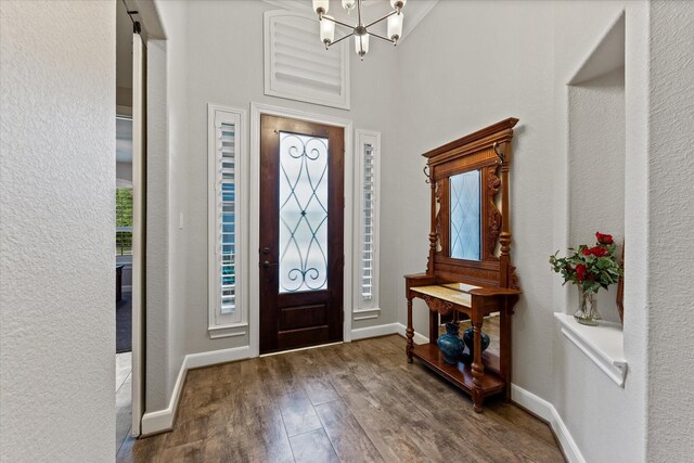 137 Gray Vervain Ct, Montgomery, TX 77316 - foyer with baseboards, a chandelier, and wood finished floors