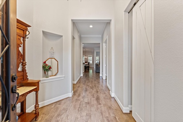137 Gray Vervain Ct, Montgomery, TX 77316 - hallway with baseboards, crown molding, light wood finished floors, and recessed lighting