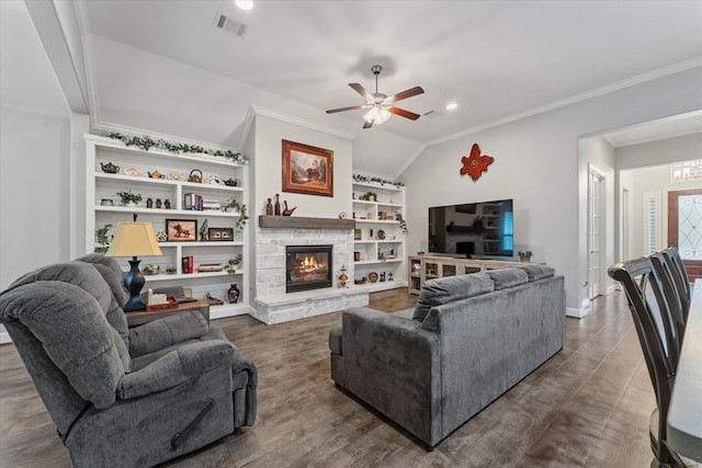 137 Gray Vervain Ct, Montgomery, TX 77316 - living area with vaulted ceiling, visible vents, ceiling fan, crown molding, and a stone fireplace