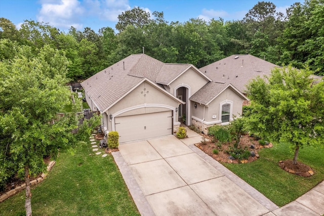 137 Gray Vervain Ct, Montgomery, TX 77316 - ranch-style home featuring driveway, fence, an attached garage, a front yard, and stucco siding