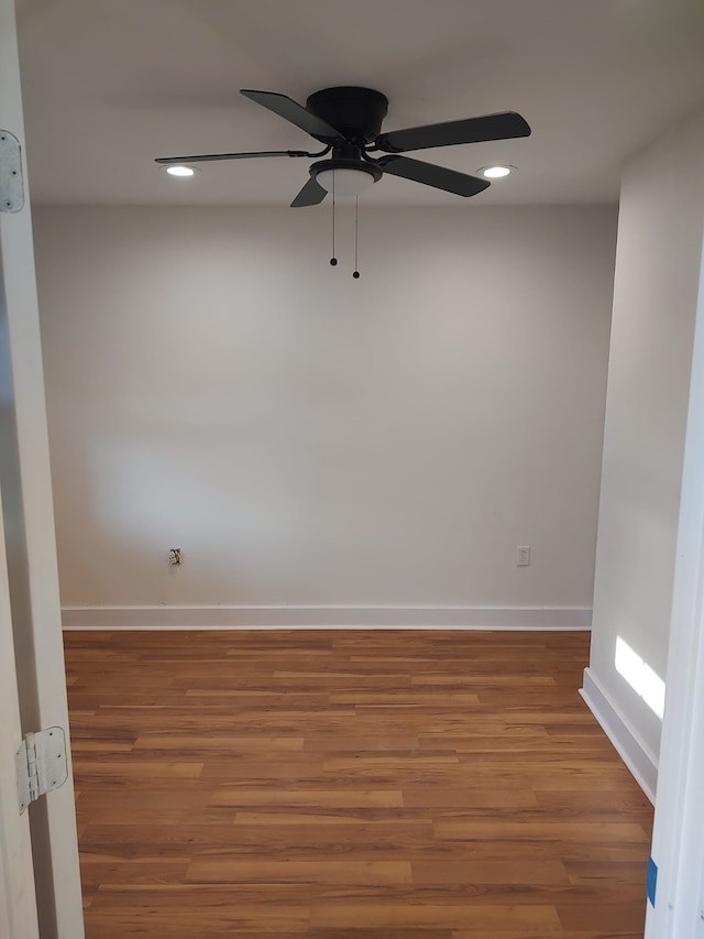 spare room with recessed lighting, ceiling fan, baseboards, and wood finished floors