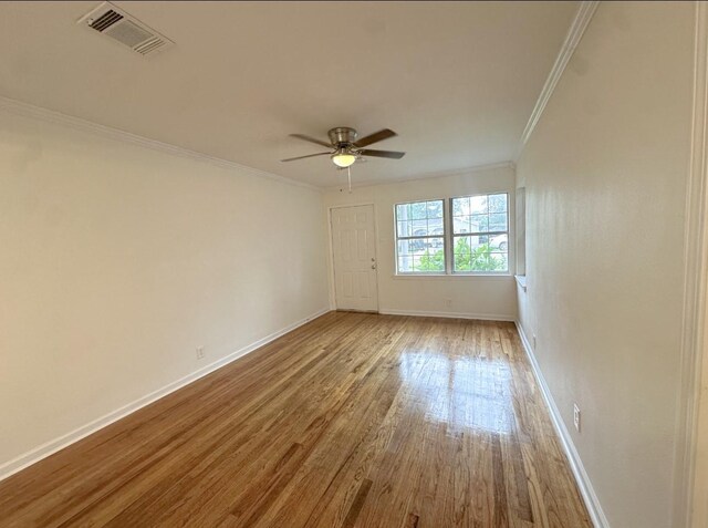 11026 Catamore St, Houston, TX 77076 - unfurnished room featuring wood finished floors, ornamental molding, a ceiling fan, and baseboards