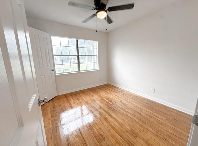 11026 Catamore St, Houston, TX 77076 - unfurnished bedroom with light wood-style flooring, baseboards, and a ceiling fan