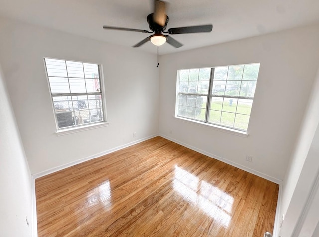 11026 Catamore St, Houston, TX 77076 - unfurnished room featuring light wood-style floors, a ceiling fan, and baseboards