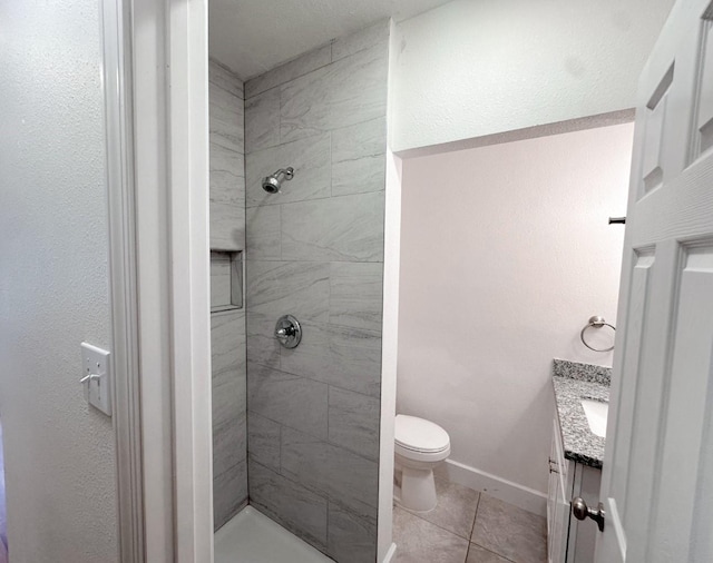 11026 Catamore St, Houston, TX 77076 - full bath featuring tiled shower, vanity, tile patterned floors, and toilet