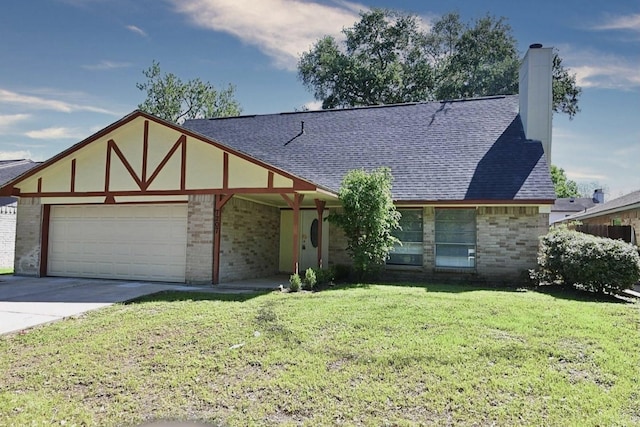 tudor home featuring an attached garage, a shingled roof, brick siding, and a front yard