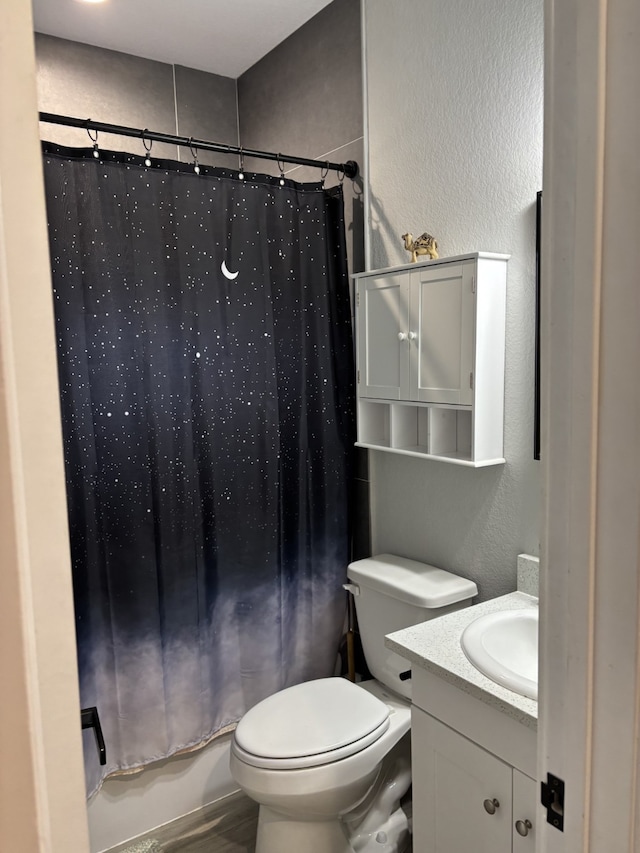 15888 Chestnut Dr, Montgomery, TX 77356 - bathroom with a textured wall, vanity, shower / bath combination with curtain, and toilet