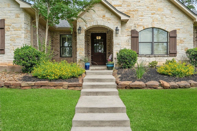 1858 Stoney Brook Ct, Conroe, TX 77304 - doorway to property with stone siding, a yard, and a shingled roof