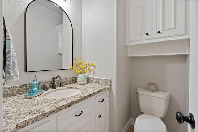 1858 Stoney Brook Ct, Conroe, TX 77304 - bathroom with vanity, toilet, and baseboards