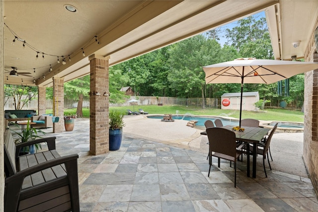 1858 Stoney Brook Ct, Conroe, TX 77304 - view of patio / terrace featuring an outdoor fire pit, outdoor dining space, and an in-ground hot tub