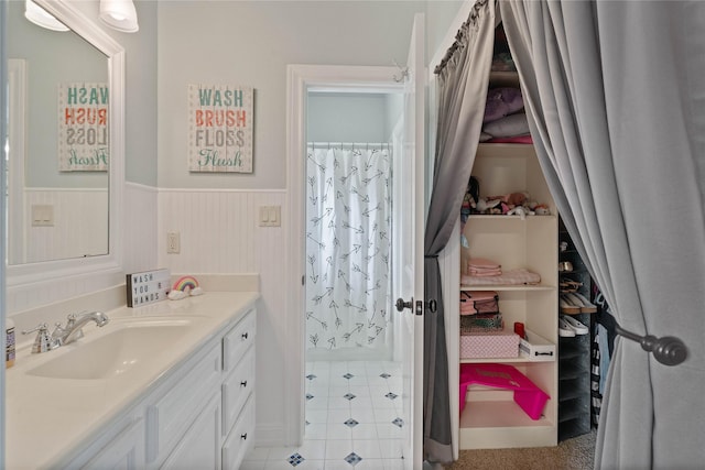 1858 Stoney Brook Ct, Conroe, TX 77304 - bathroom with wainscoting and vanity