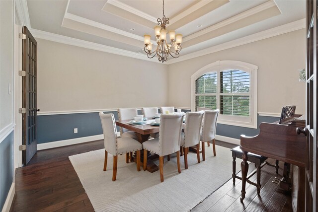 1858 Stoney Brook Ct, Conroe, TX 77304 - dining space with a raised ceiling, a chandelier, ornamental molding, hardwood / wood-style floors, and baseboards