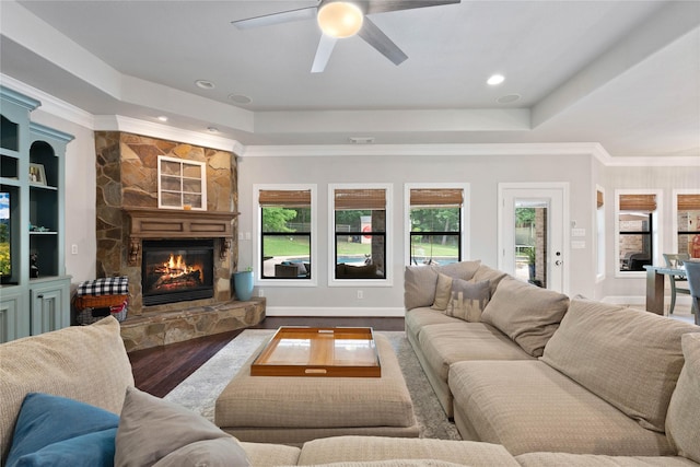 1858 Stoney Brook Ct, Conroe, TX 77304 - living room featuring a raised ceiling, plenty of natural light, a fireplace, ceiling fan, and recessed lighting