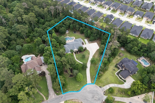 1858 Stoney Brook Ct, Conroe, TX 77304 - aerial perspective of suburban area with property parcel outlined