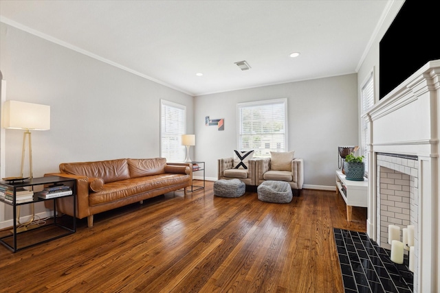 6402 Brookside Dr, Houston, TX 77023 - living room with wood finished floors, ornamental molding, baseboards, a tiled fireplace, and recessed lighting