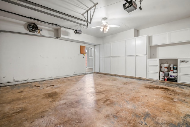 garage featuring a garage door opener and a ceiling fan