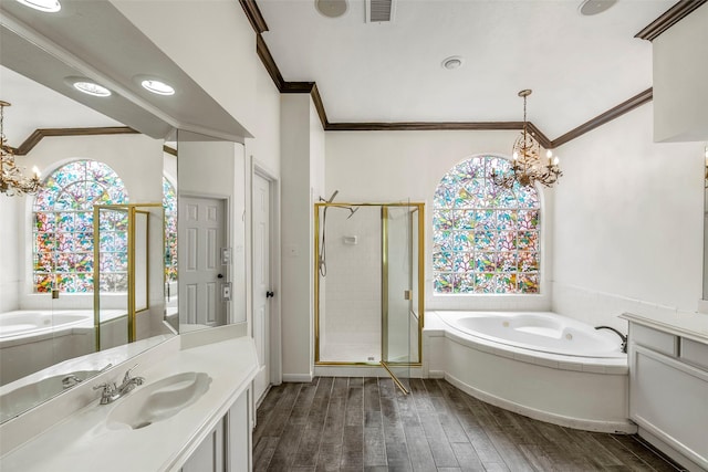 bathroom with visible vents, an inviting chandelier, ornamental molding, and wood finished floors