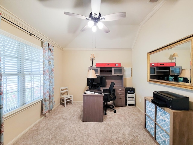 carpeted office space featuring crown molding, ceiling fan, baseboards, and lofted ceiling