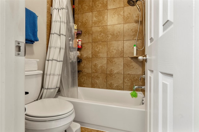 bathroom featuring shower / tub combo with curtain and toilet