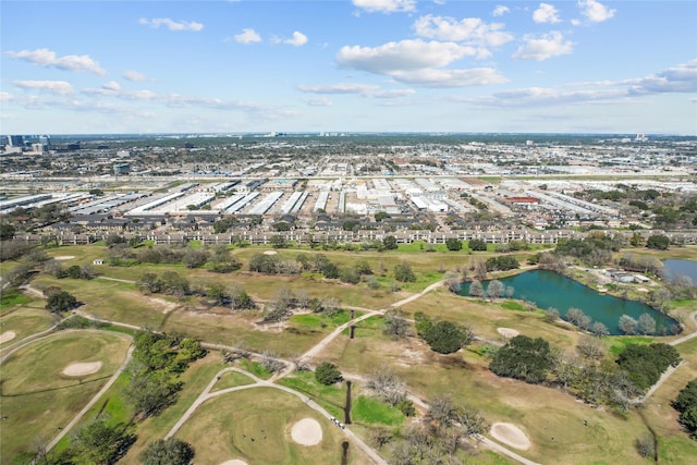 birds eye view of property featuring a water view and golf course view
