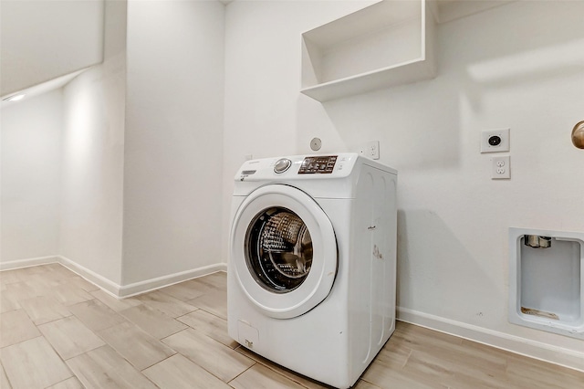 3007 Velda May Dr, Richmond, TX 77406 - laundry room with washer / clothes dryer, laundry area, baseboards, and wood finish floors