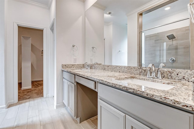 3007 Velda May Dr, Richmond, TX 77406 - bathroom featuring a sink, a tile shower, double vanity, and crown molding