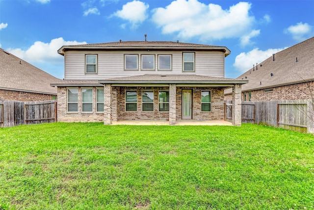 3007 Velda May Dr, Richmond, TX 77406 - back of property with brick siding, a yard, a patio, and a fenced backyard