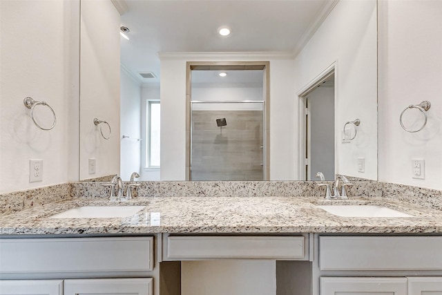3007 Velda May Dr, Richmond, TX 77406 - bathroom featuring crown molding, visible vents, a sink, and a stall shower