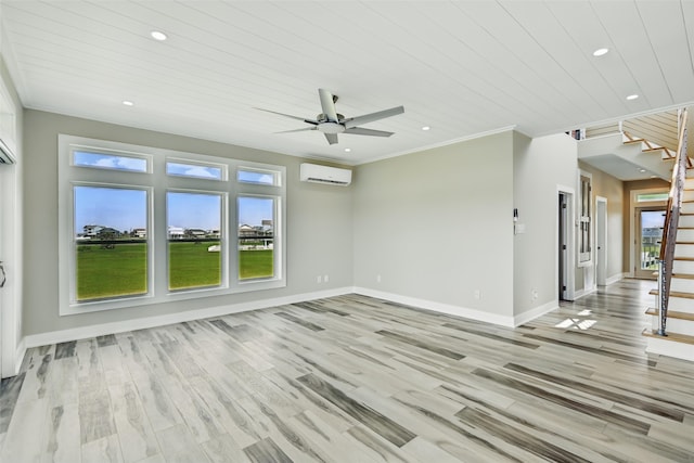 4102 Kiva Rd, Galveston, TX 77554 - interior space with baseboards, ornamental molding, an AC wall unit, stairs, and light wood-style flooring