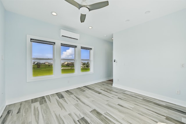4102 Kiva Rd, Galveston, TX 77554 - empty room with recessed lighting, light wood finished floors, an AC wall unit, and baseboards