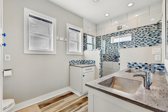4102 Kiva Rd, Galveston, TX 77554 - full bathroom with toilet, baseboards, a stall shower, and vanity