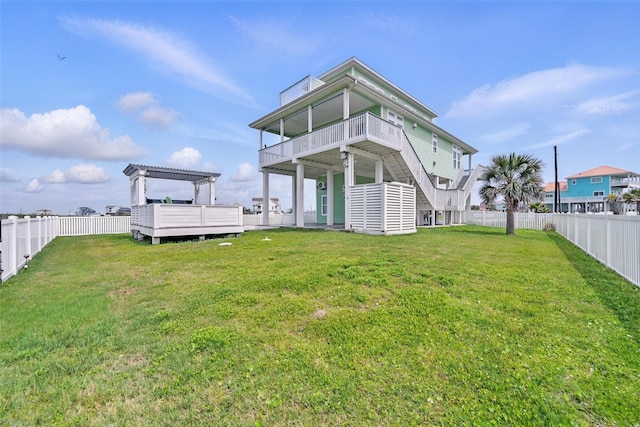 4102 Kiva Rd, Galveston, TX 77554 - rear view of house featuring a pergola, a yard, and a fenced backyard