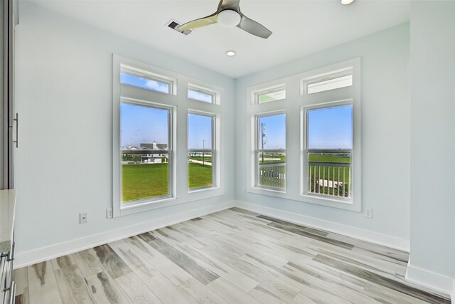 4102 Kiva Rd, Galveston, TX 77554 - unfurnished sunroom featuring wood finished floors, baseboards, visible vents, and recessed lighting