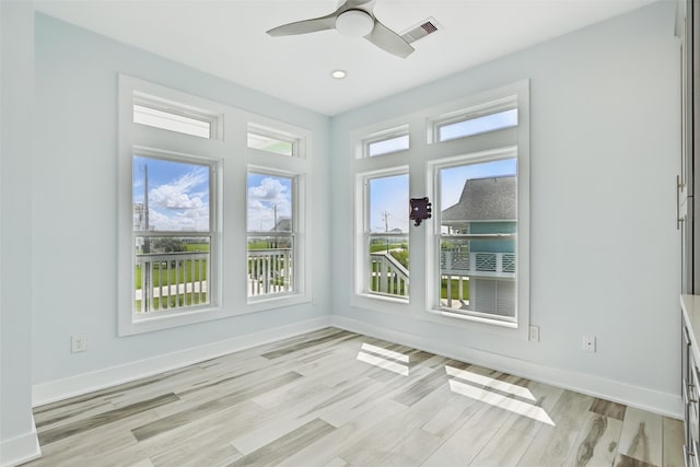 4102 Kiva Rd, Galveston, TX 77554 - unfurnished room with visible vents, light wood-type flooring, baseboards, and a ceiling fan