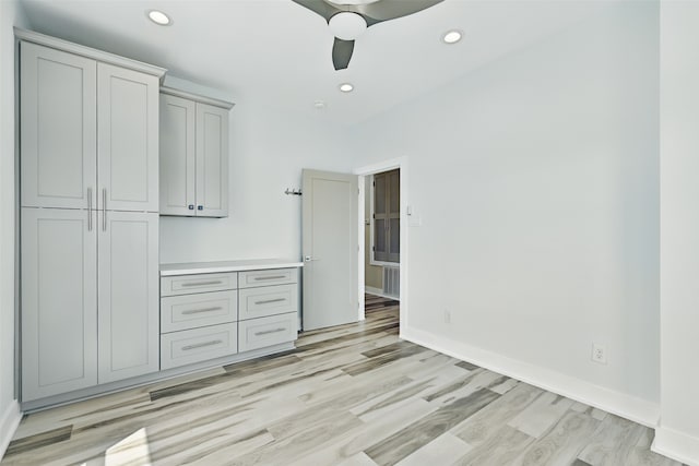 4102 Kiva Rd, Galveston, TX 77554 - unfurnished bedroom featuring baseboards, light wood-type flooring, ceiling fan, and recessed lighting
