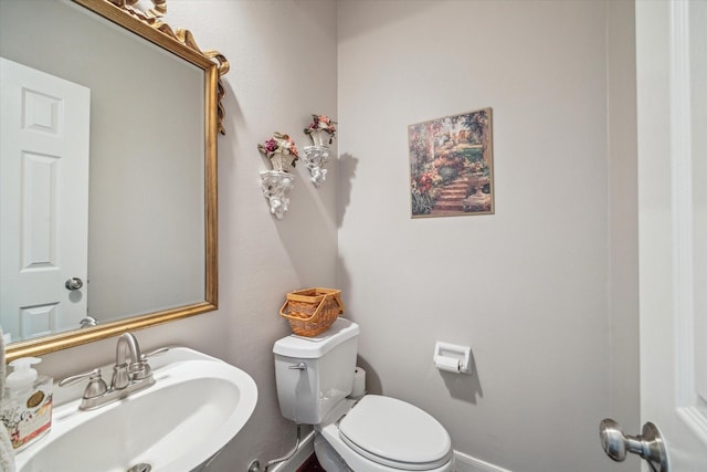 bathroom featuring a sink and toilet