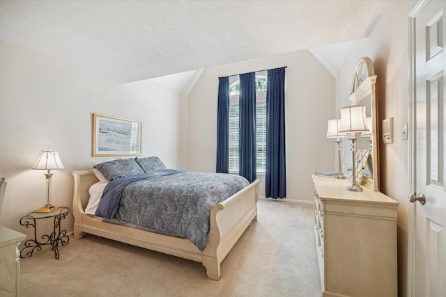 bedroom featuring baseboards, light colored carpet, a textured ceiling, and lofted ceiling