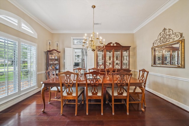 dining area with a chandelier, crown molding, dark wood finished floors, and visible vents