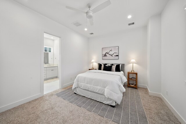 845 Elkhart St Unit C, Houston, TX 77091 - bedroom featuring light carpet, recessed lighting, ensuite bathroom, and baseboards
