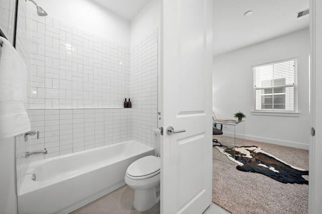 845 Elkhart St Unit C, Houston, TX 77091 - bathroom featuring toilet and washtub / shower combination
